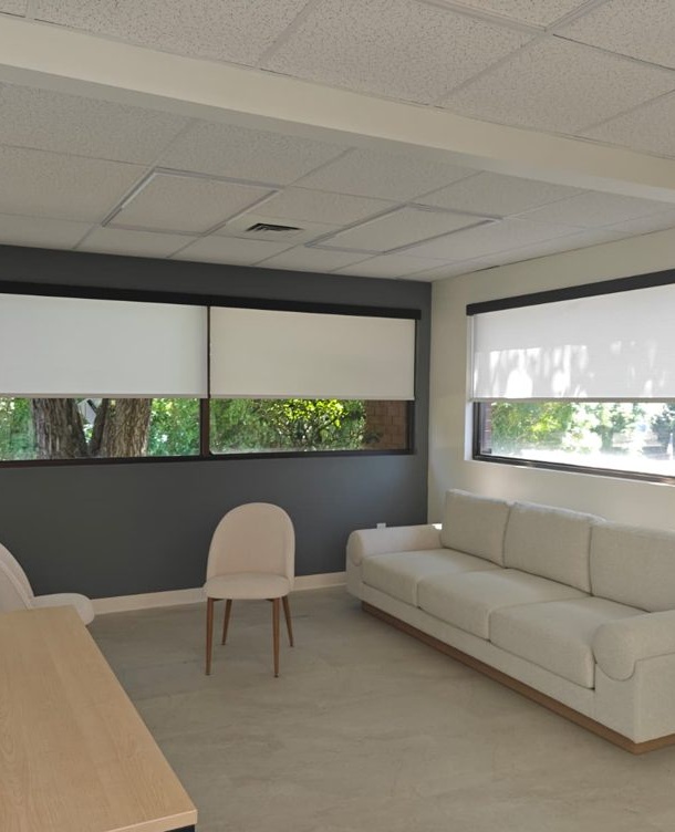 Light-filtering roller shades in a seating area